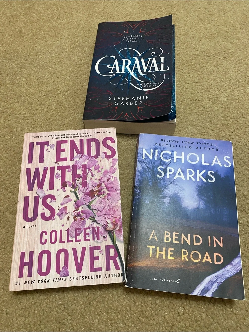 Set of 3 Paperback Novels: It Ends With Us, Caraval, A Bend In The Road